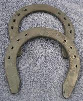 4 Spanish Lake Draft Front per pair - Spanish Lake Draft Horse Shoes are available in 3/8" thickness. They are made similar to hand forged shoes, with punched nail holes (not creased). They do not have toe clips. Available in both front and hind patterns.  Use Regular Head nails 6 or larger. 