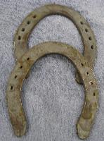 7 Spanish Lake Draft Hind per pair - Spanish Lake Draft Horse Shoes are available in 3/8" thickness. They are made similar to hand forged shoes, with punched nail holes (not creased). They do not have toe clips. Available in both front and hind patterns.  Use Regular Head nails 6 or larger. 